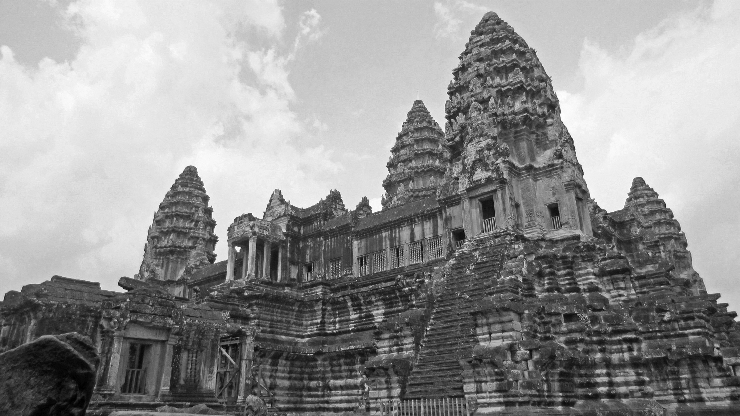 Angkor Wat rising beneath a dramatic sky in black and white