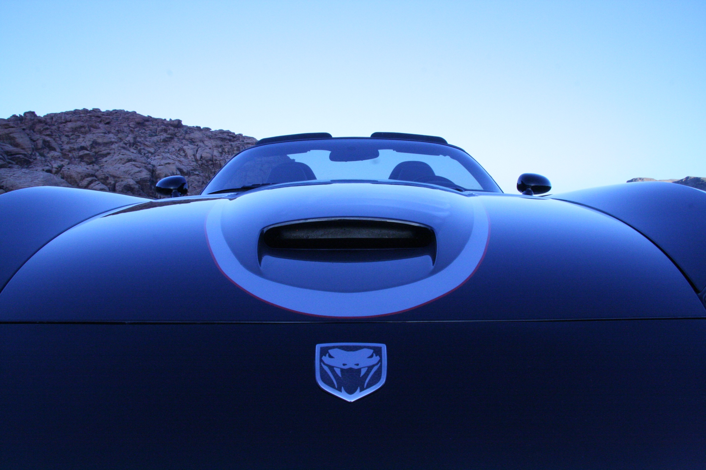 A blue Dodge Viper photographed from a dramatic low angle
